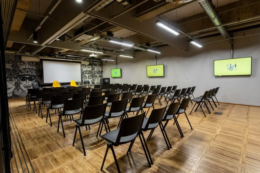 An event room set in rows facing a screen